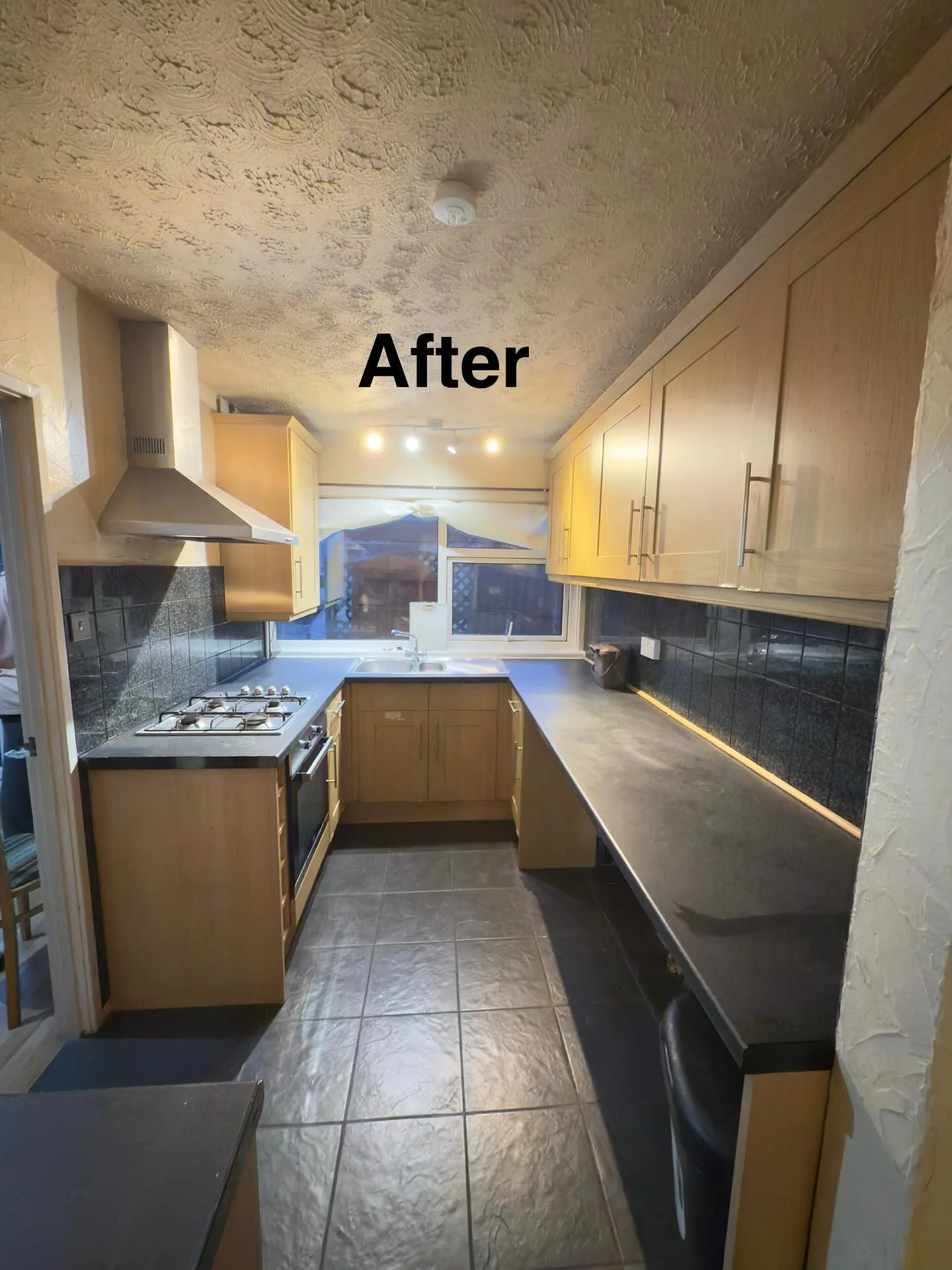 Same kitchen spotless and tidy after the clean