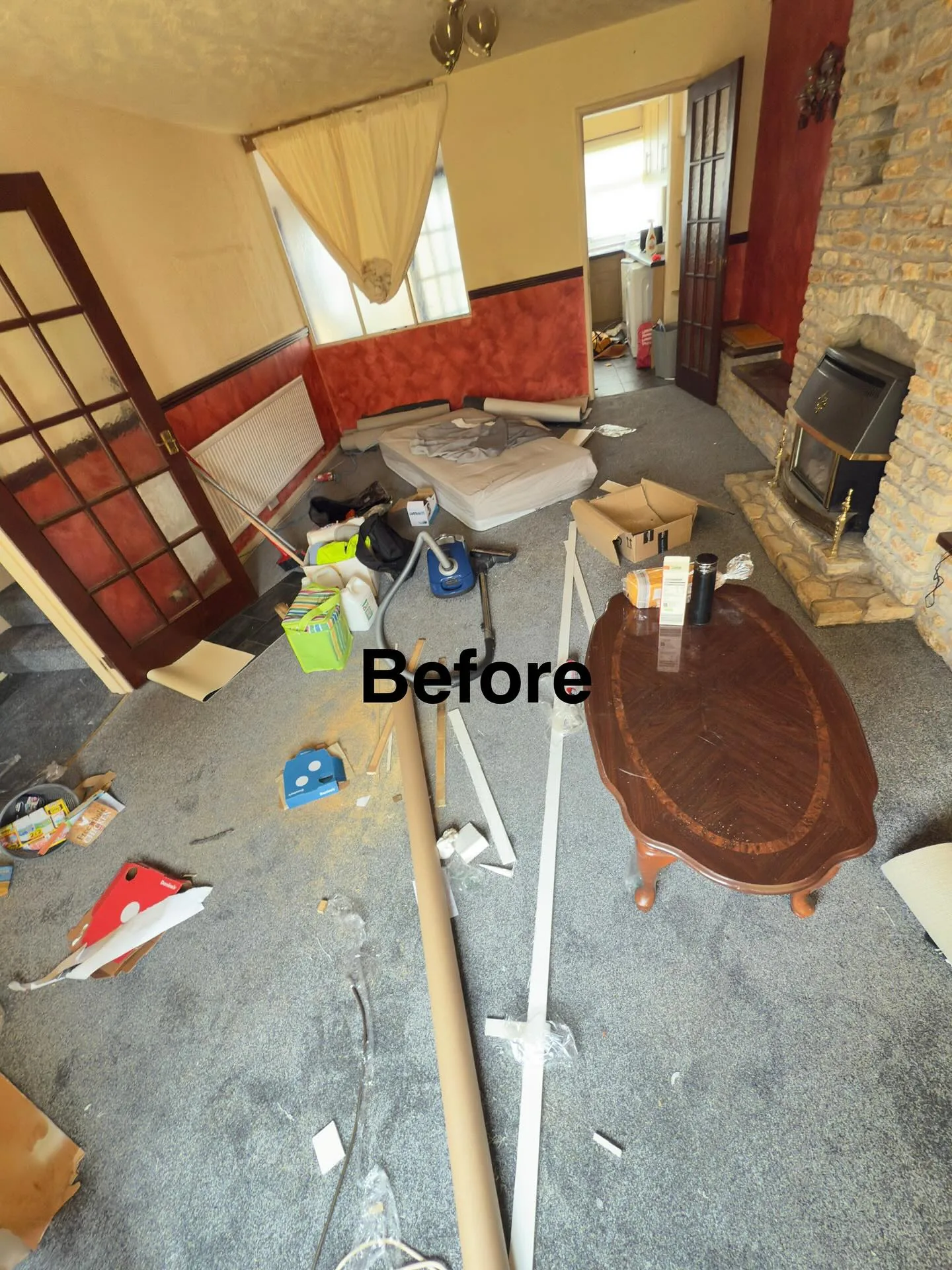 Living room full of packaging and debris before a post-move clean
