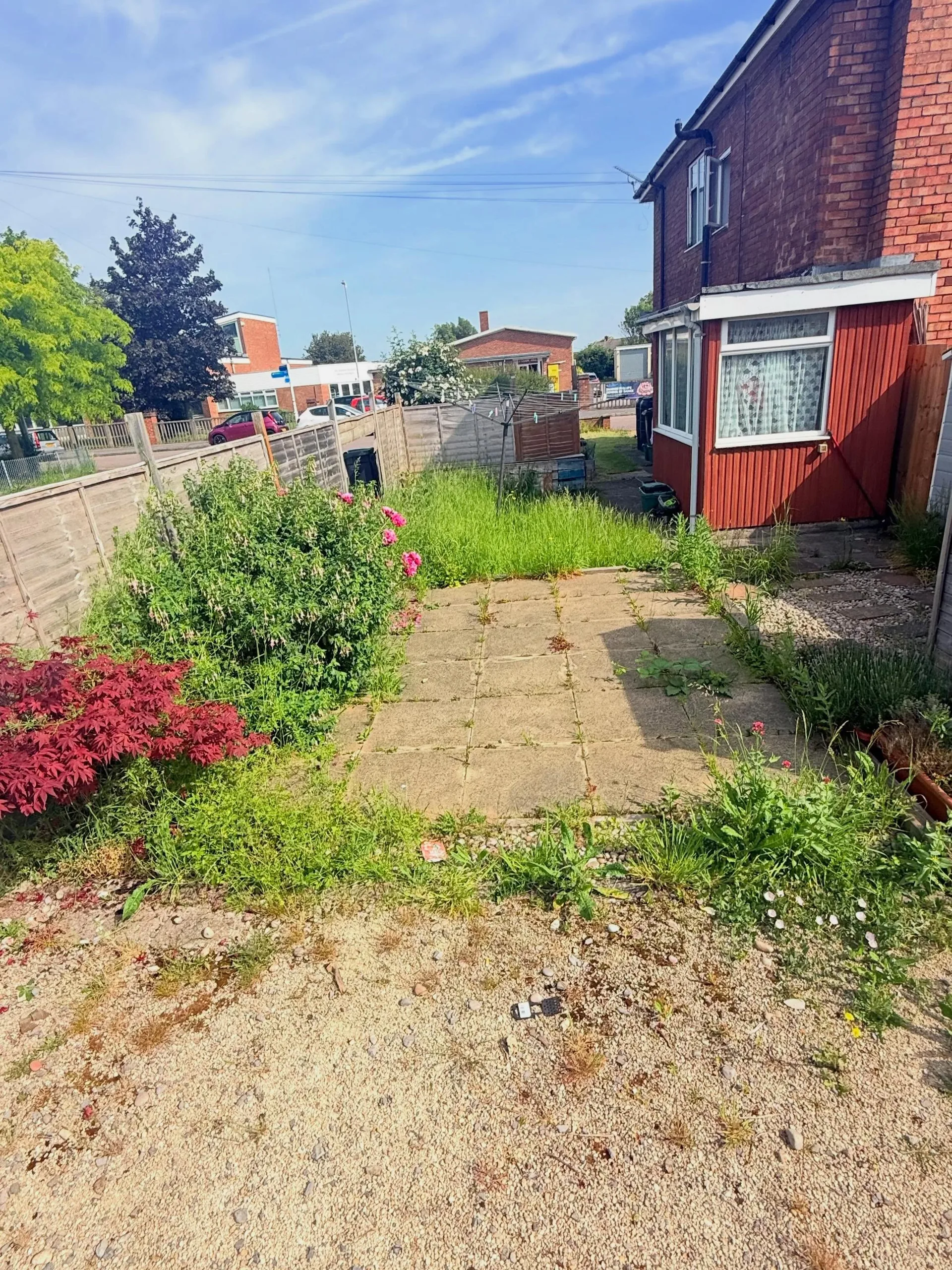 Neatly kept flowerbed and border alongside a mowed lawn