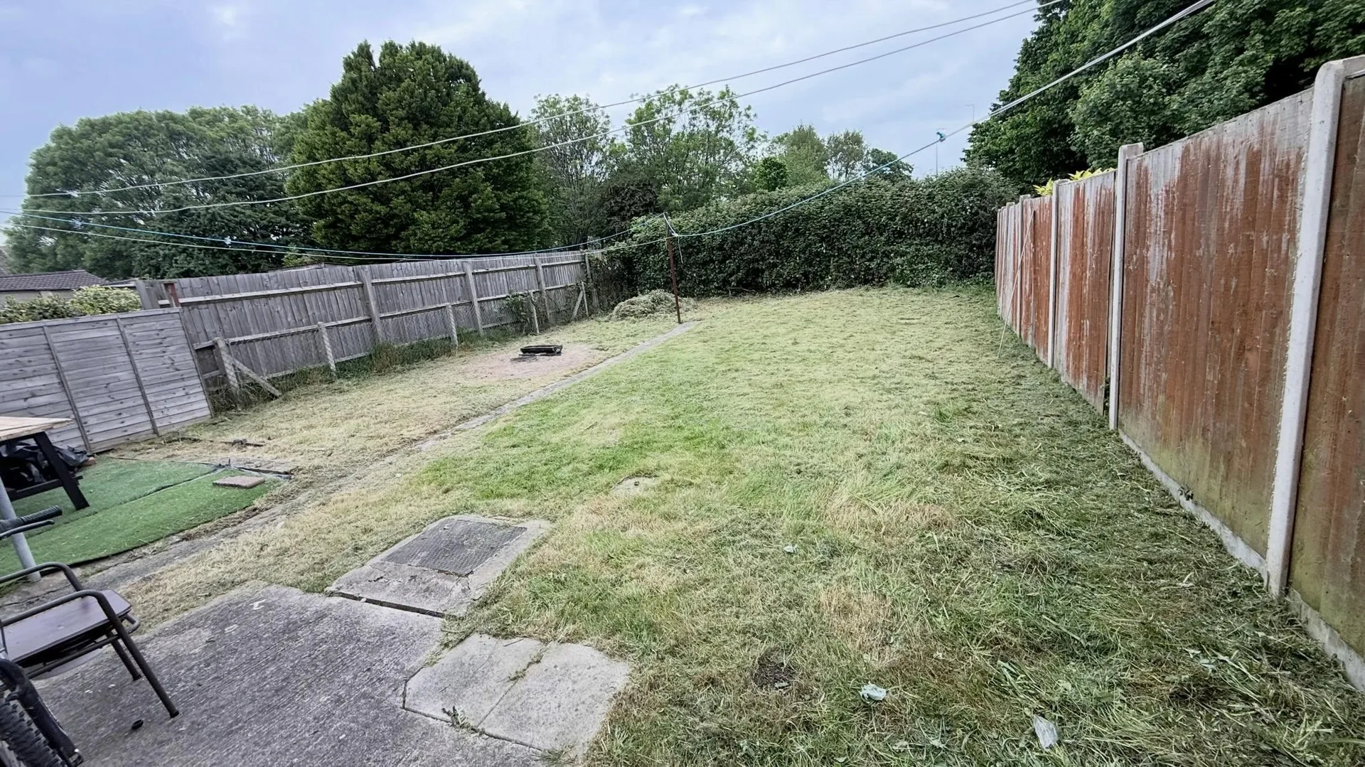 Same garden cleared to a tidy gravel patio
